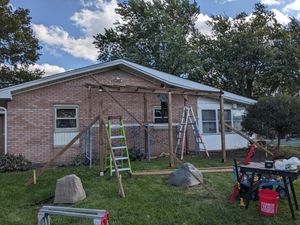Catio construction with ladders and tools